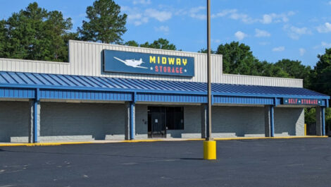 Parking lot and front door entrance to Midway Storage in Camden.