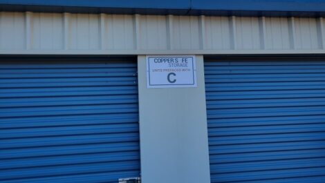 Exterior of storage unit with Copper Safe Storage signage in Childersburg, AL.