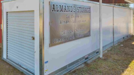 Sign on the side of a drive up storage unit for Almands Self Storage in Moultrie.
