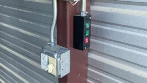 A switch to open a storage unit.