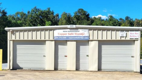Exterior of storage units with sign: under new management, Copper Safe Storage, 254-378-5500 in Childersburg, AL.