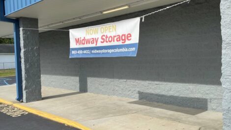 Banner say Midway Storage is now open.