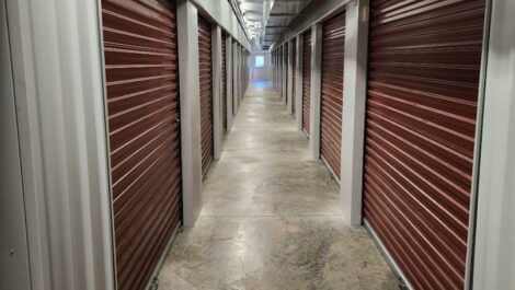 Hallway inside with storage units at Copper Safe Storage in Crowley.