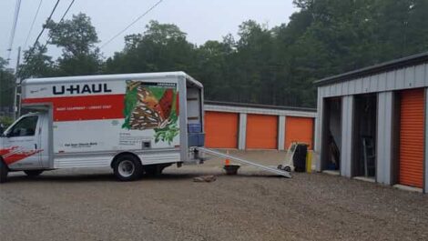 U-haul being unloaded into a drive up storage unit at the Renegade Storage.