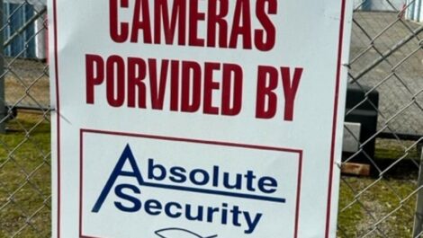 Sign stating cameras provided by absolute storage in Greenbrier, AR.