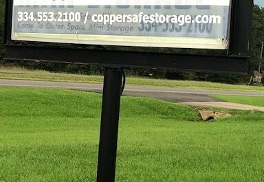 Signage stating 334.553.2100 / coppersafestorage.com in Selma, AL.
