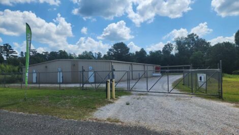 Locked security gate for storage facility in Columbia, MS.