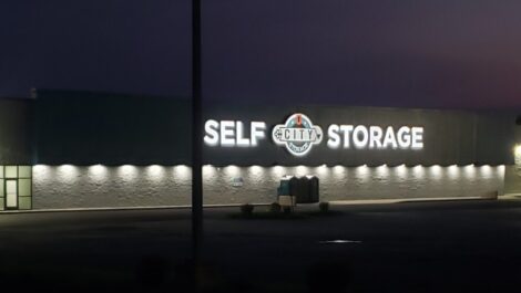 The exterior of City Storage lit up at dusk in Macon, GA.