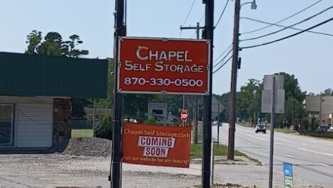 Sign stating Chapel Self Storage 870-330-0500 in Pine Bluff, AR.