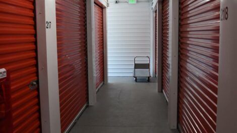Exterior of orange storage units at Olympia Extra Storage facility.