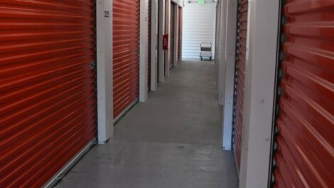 Exterior of orange storage units at Olympia Extra Storage facility.