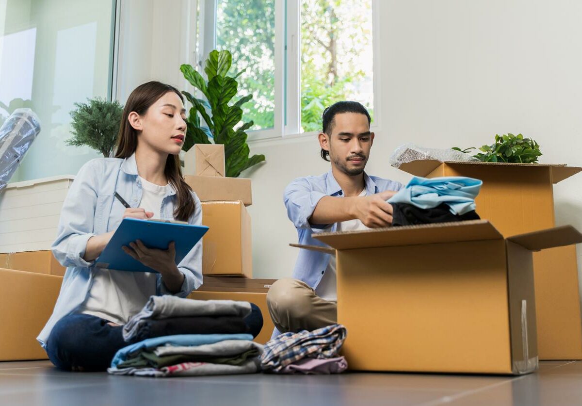 A couple organizing their self storage boxes