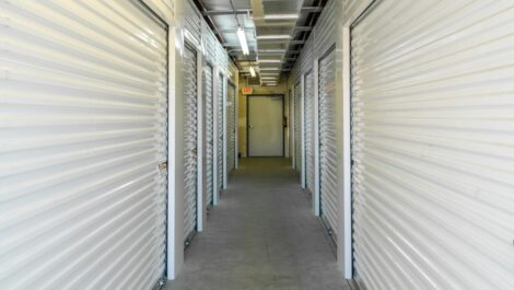 Hallway view of indoor storage units.