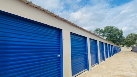 Outdoor storage facilities with blue doors.