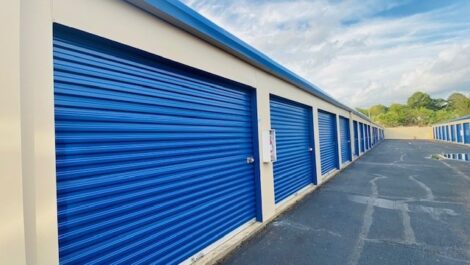 Blue storage units with drive-up access.