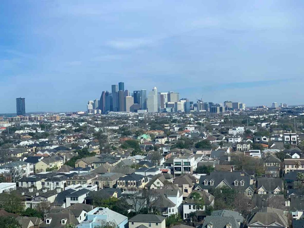 : Residential houses are in the foreground, and Downtown Houston is in the background. (Source)