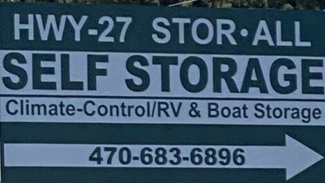 HWY- 27 Stor-All Self Storage sign with arrow.