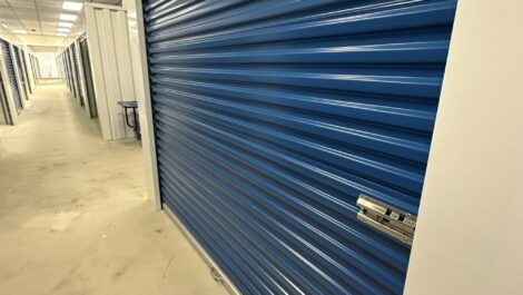 Indoor storage unit with blue door.