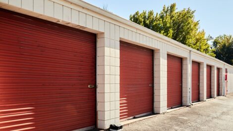 Storage units with red doors and a place to add a lock.