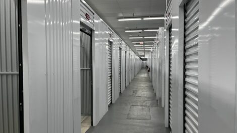 Interior corridor of Q Space with storage unit doors on either side