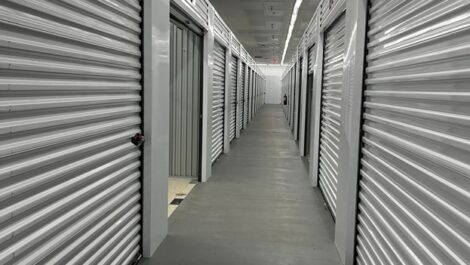 Interior corridor of Q Space with multiple storage unit doors on either side