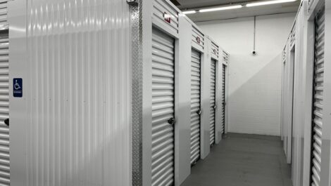 Interior corridor of Q Space with storage unit doors on either side