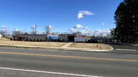 State College Storage facility showing a mix of small and large storage units arranged on a gravel lot, with open units and fences visible.